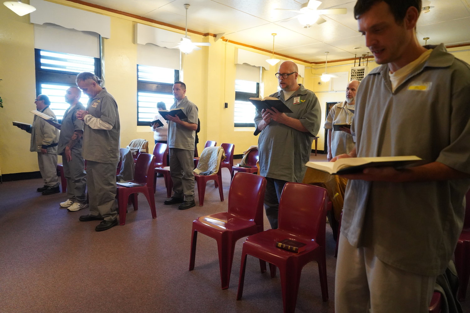 Residents of the Algoa Correctional Center in Jefferson City and volunteers sing a hymn during Mass offered by Bishop W. Shawn McKnight and Father Michael Penn on Nov. 6.